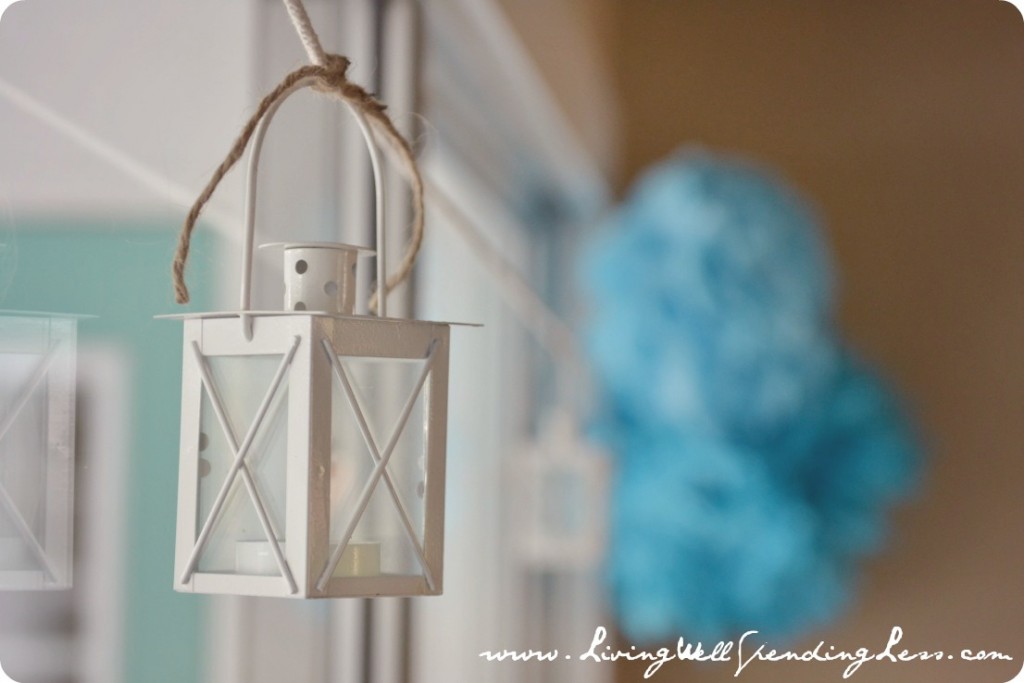 Lanterns hung around the room, tied with twine. 