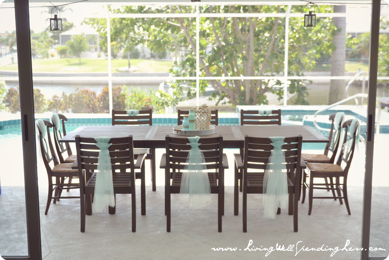 The poolside dining table and chairs were tied with piece of tulle to keep the underwater theme going.