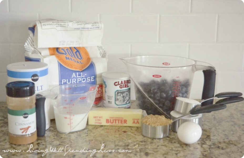 Assemble your ingredients for the cake: butter, sugar, egg, flour, baking powder, salt, milk, blueberries, brown sugar, cinnamon, sour cream, powdered sugar, vanilla and baking soda. 