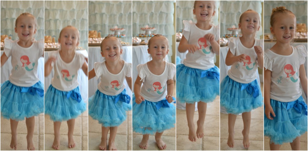 The happiest little mermaid party girl in her frilly blue skirt and t-shirt with Mermaid transfer.