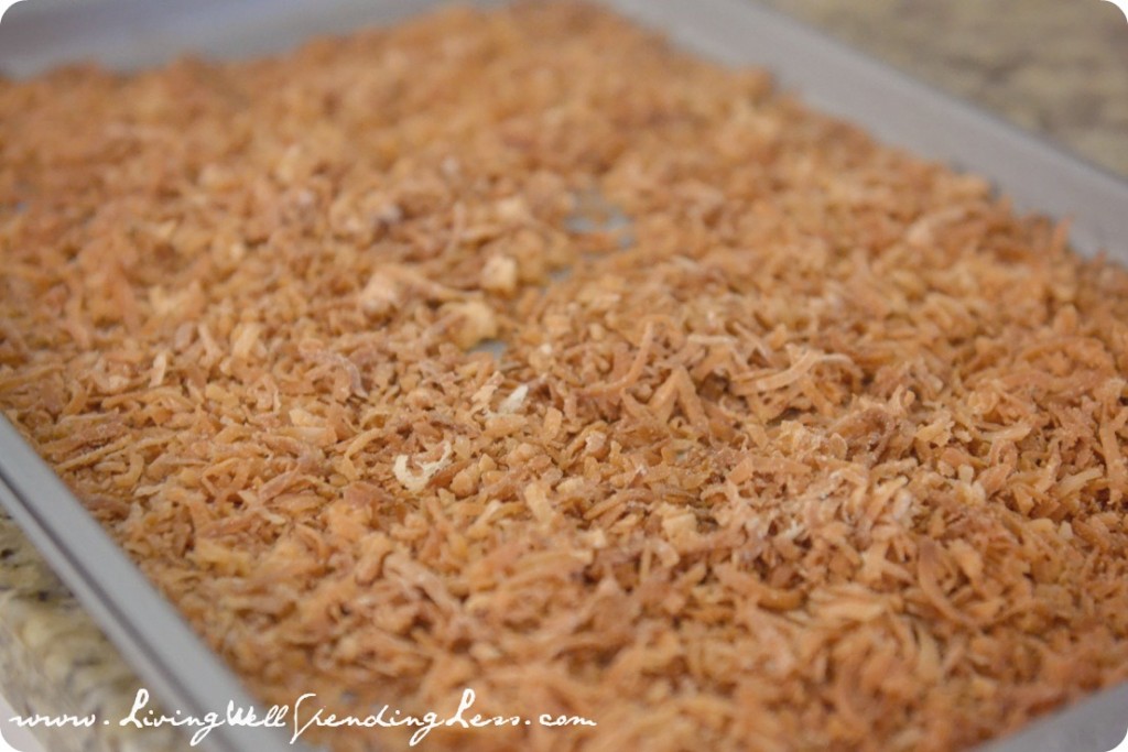 Toast the coconut for the sand mixture that will cover the outside of your cake. 