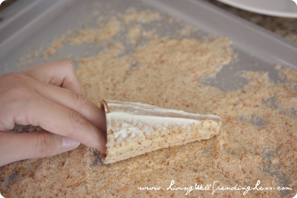 Use cones covered in frosting to make the turrets for your castle. Roll them in the toasted coconut and graham cracker crumbs. 