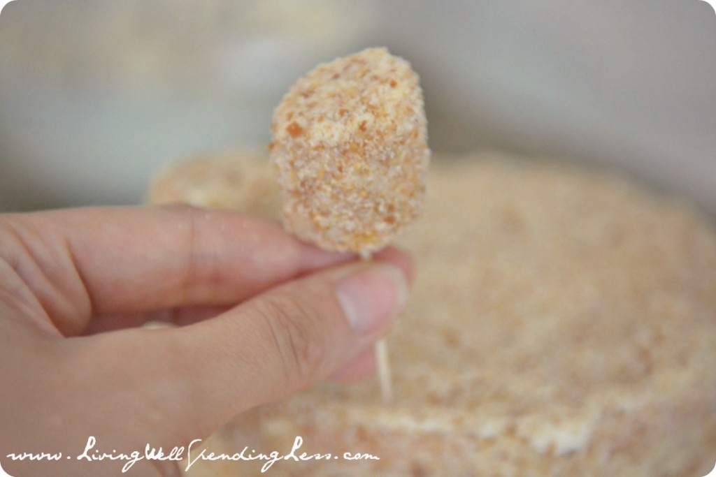 Insert a toothpick into the battlements and add them to the top of the sandcastle cake. 