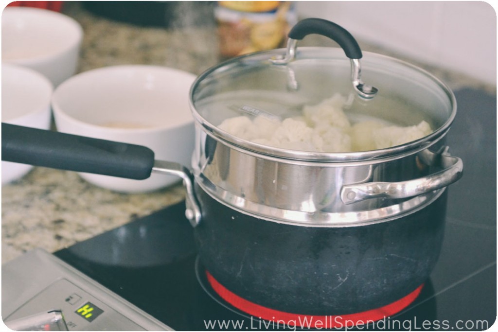 Steam cauliflower until tender, then season with salt and pepper. 