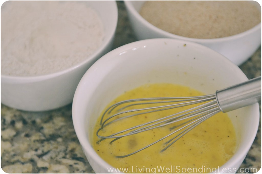 Prepare the egg, flour, and breadcrumbs for breading the cauliflower pieces. 