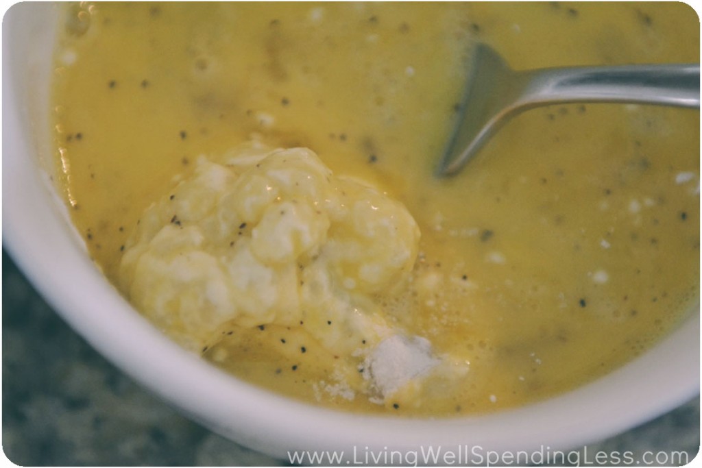 Coat the flour-coated cauliflower in the seasoned egg mixture. 