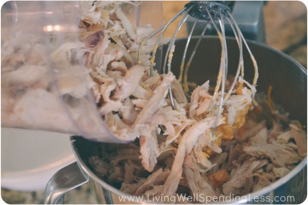 Add shredded chicken into the mixing bowl with buffalo sauce mixture.