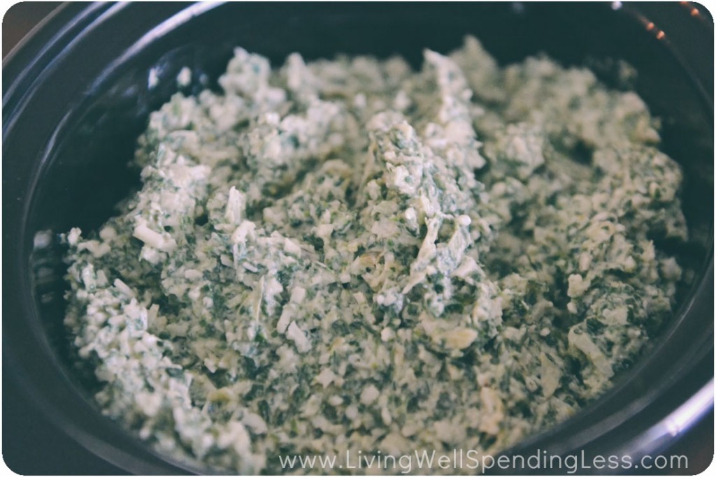 Add spinach and artichoke dip to the slow cooker and set to low