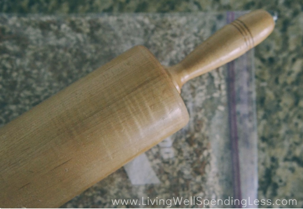 Use a rolling pin to crush the pretzels in a freezer bag.