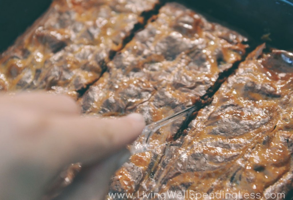 Bake brownies until cooked through, allow to cool and then slice. 