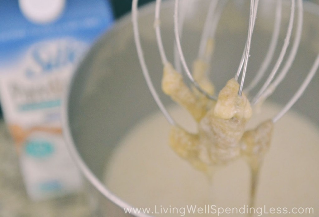 Add banana, vanilla, coconut oil, and almond milk to mixer and blend.  