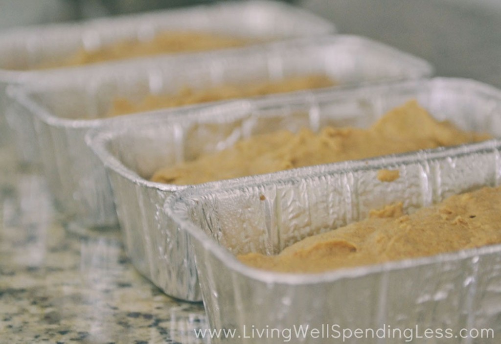 Divide pumpkin bread batter into four reusable loaf pans. 