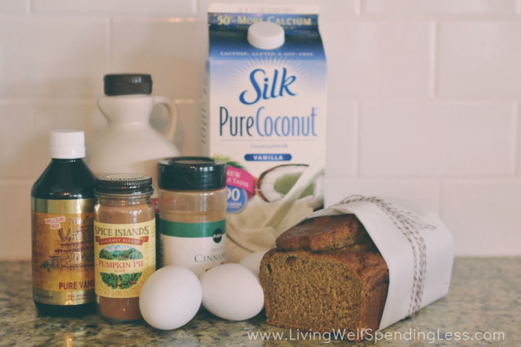 Assemble the pumpkin bread french toast ingredients: pumpkin bread, coconut milk, vanilla, eggs, maple syrup, cinnamon, pumpkin pie spice, butter, coconut oil, and powdered sugar. 