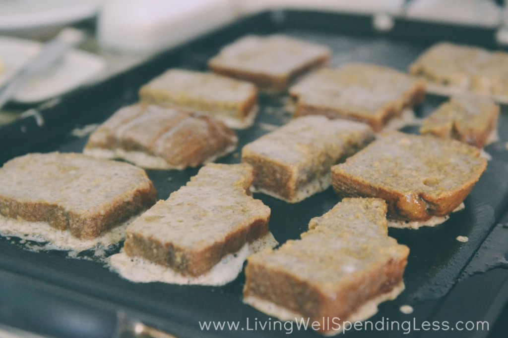 Place coated bread slices on hot griddle and cook until golden brown.