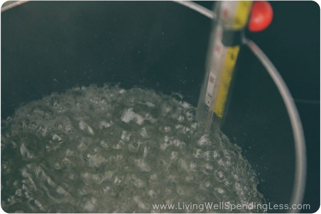 Clip candy thermometer to side of saucepan.