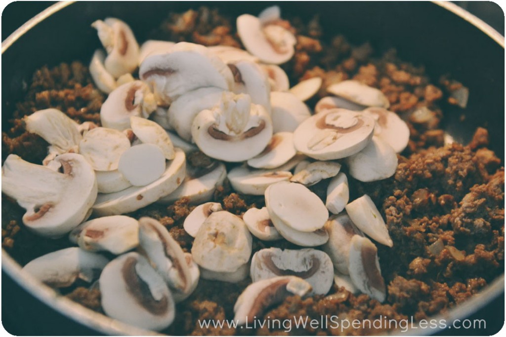 Stir vegetarian crumbles and mushrooms together in pan. 