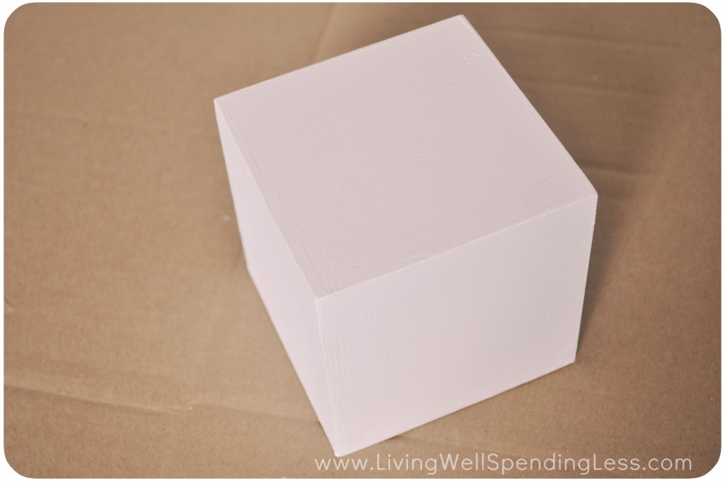 This DIY photo block project starts out with one plain wooden block. I painted this wooden block white.