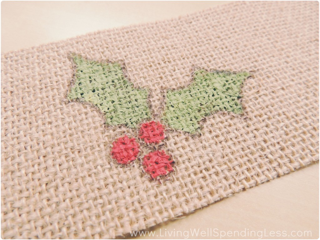 I painted the holly design on my burlap ribbon using red and green acrylic paint. 