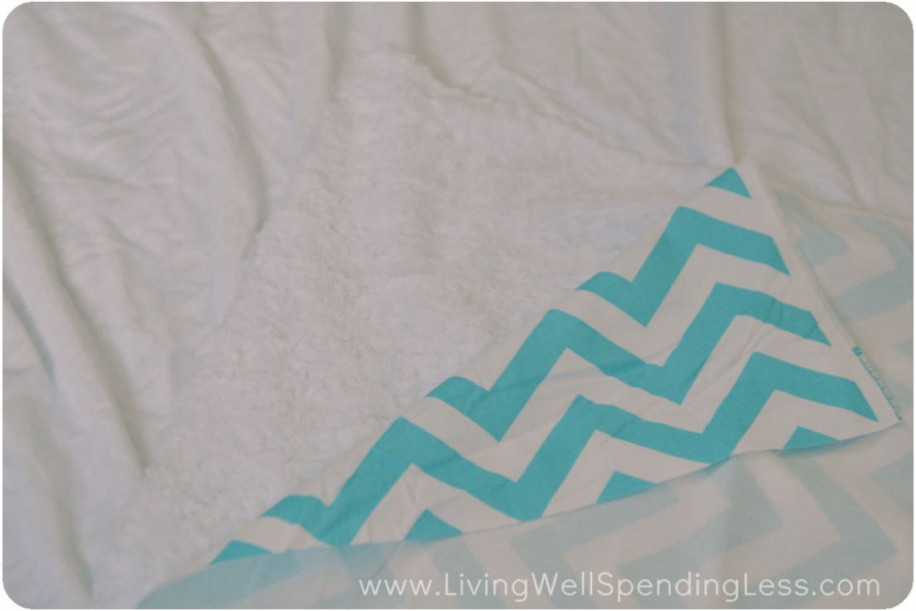 Lay out minky fabric, soft side up then spread out chevron fabric on top. 