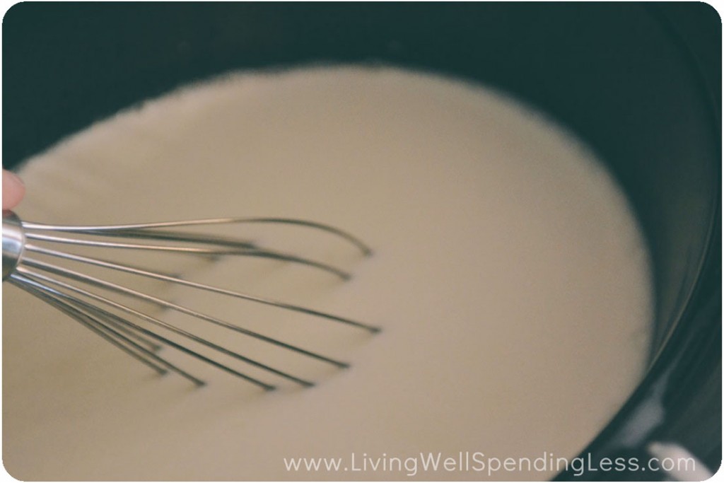 Whisk room temperature yogurt into the cooled milk.