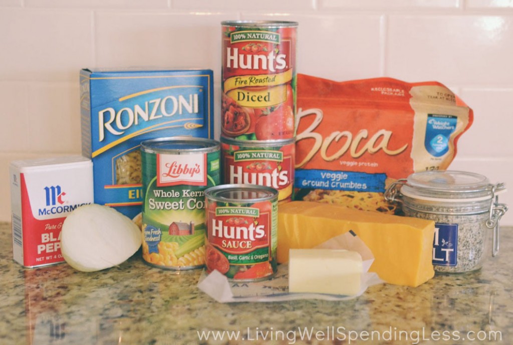 Assemble the goulash ingredients: macaroni, tomato sauce, veggie crumbles, cheese and seasonings. 