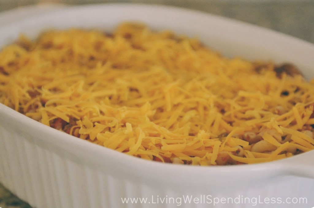Put the goulash in a casserole dish and top with shredded cheese. 