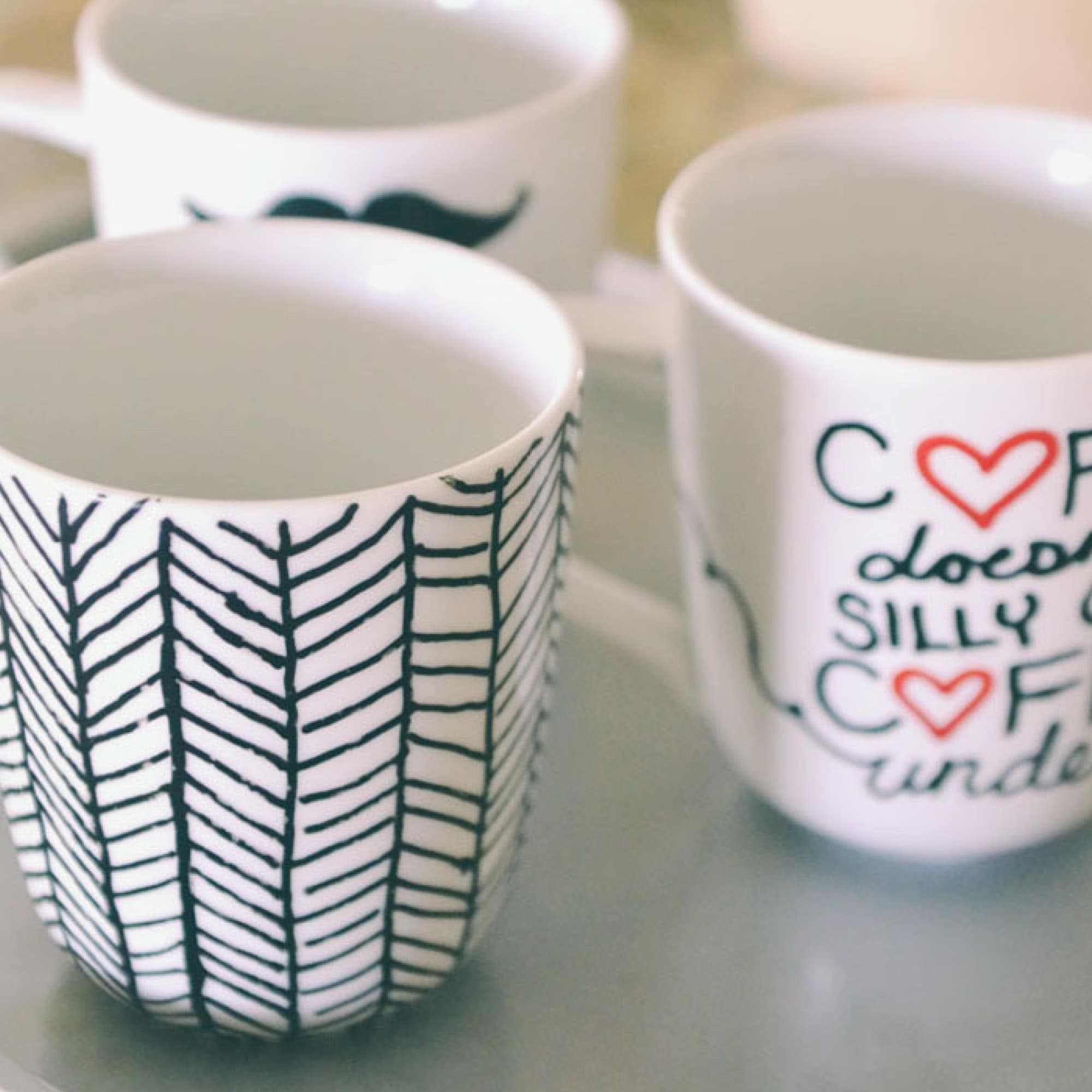 https://www.livingwellspendingless.com/wp-content/uploads/2014/02/DIY-Sharpie-Mugs-SQUARE2.jpg