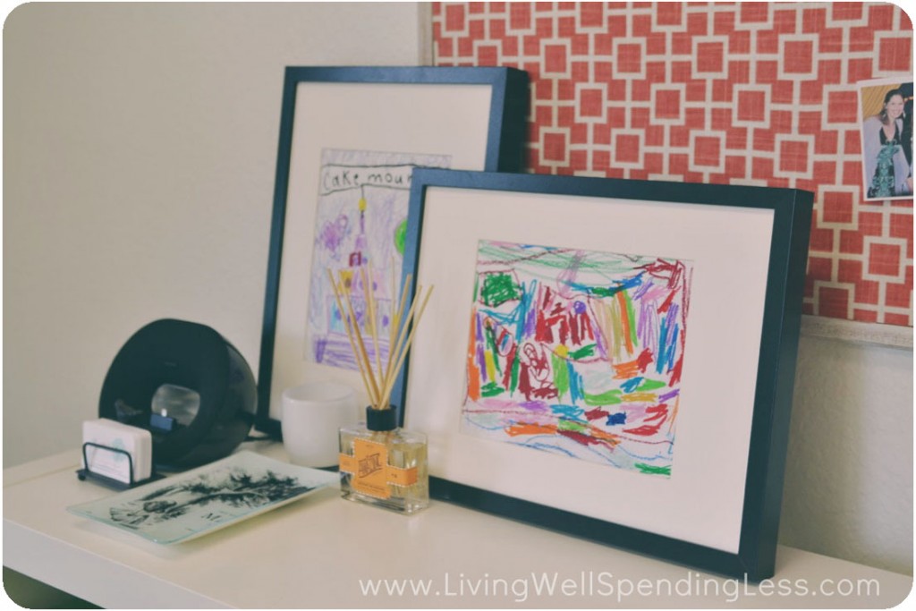 Artwork from my daughters looks bright and cheerful in frames, atop the book shelf. I added a few accessories including a reed diffuser and business card organizer. 