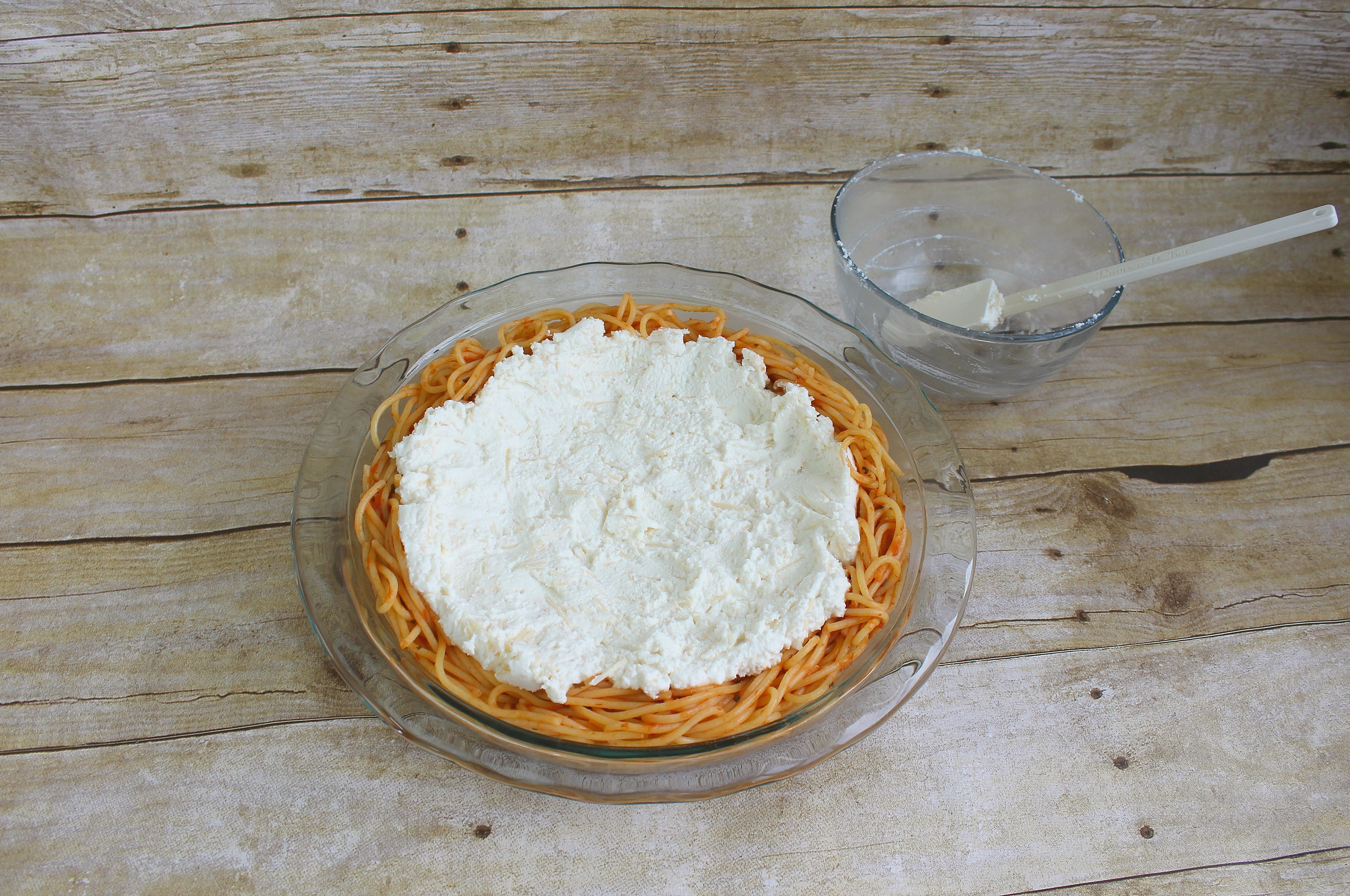 Spread ricotta mixture over noodles.