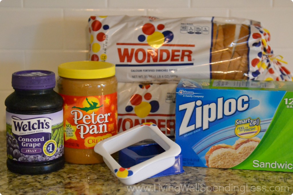 Gather all the ingredients you'll need for these DIY Uncrustables: Jelly, peanut butter, Wonder bread, Ziploc bags and a sandwich cutter. 