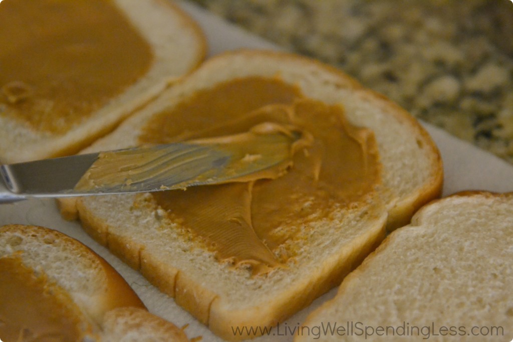 Add peanut butter to each slice of bread, avoiding the edges. 