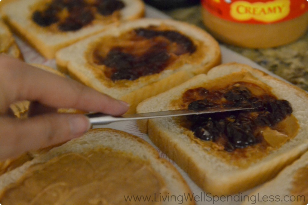 Use a knife to spread jelly on top of each layer of peanut butter.