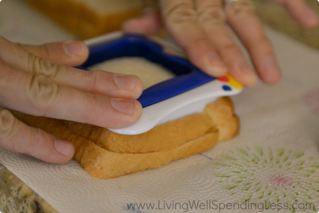 Using the sandwich cutter, press out the sandwiches and remove the crusts. 