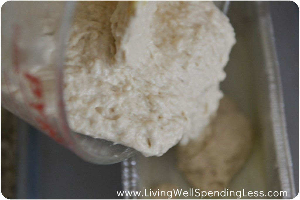 Pour the bread mixture into a greased loaf pan. 