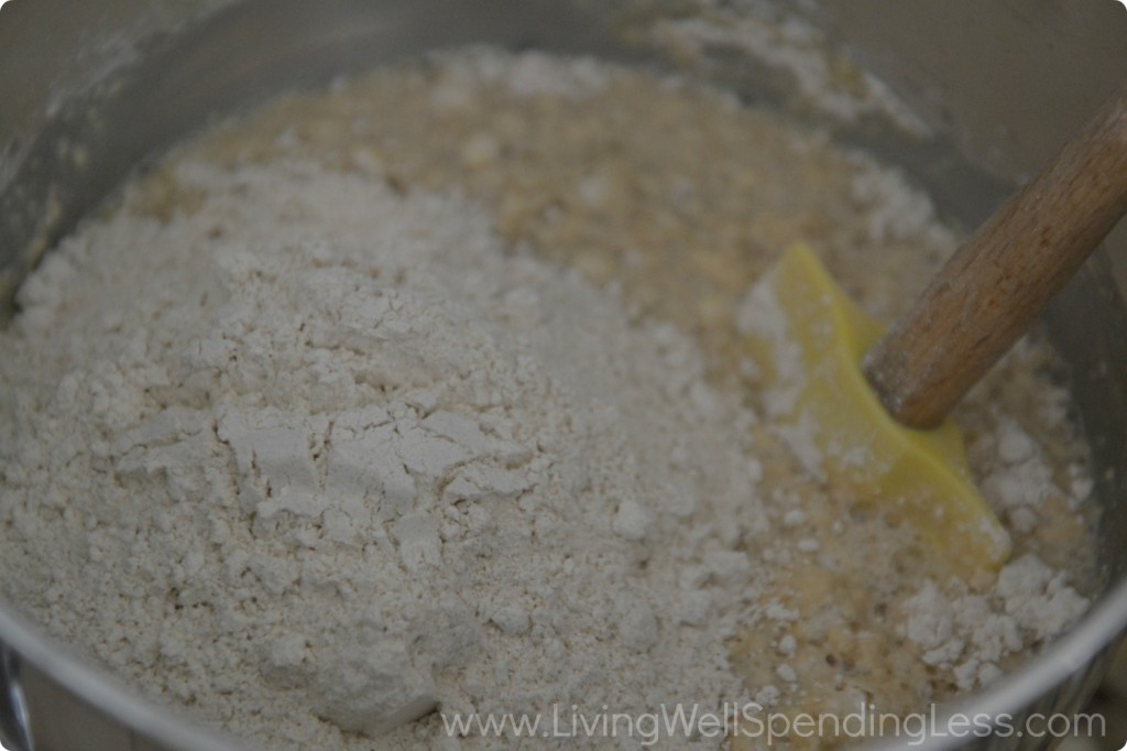 Mix in flour, slowly. Mix about 1-2 cups at a time while mixing. 