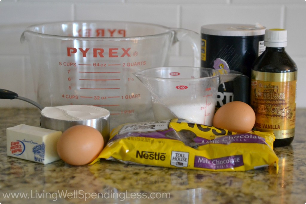 Assemble your ingredients: chocolate chips, butter, sugar, eggs, flour, salt, vanilla and walnuts. 