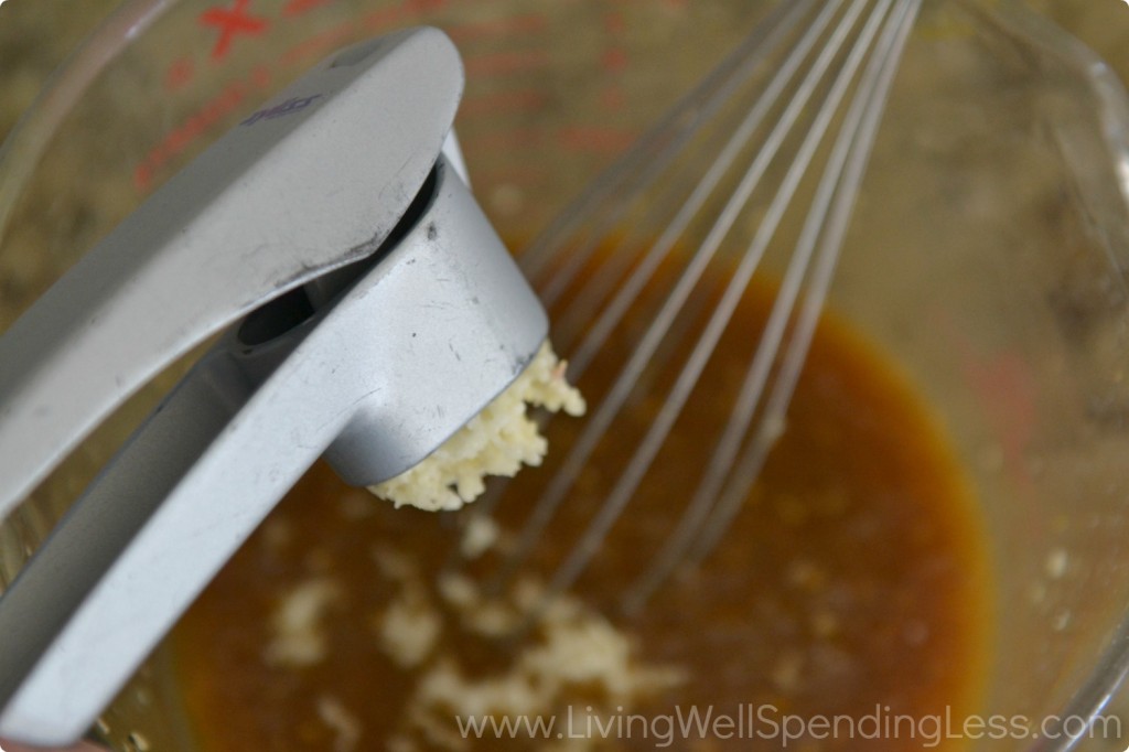 Mince the garlic gloves using a garlic press and whisk into the marinade.