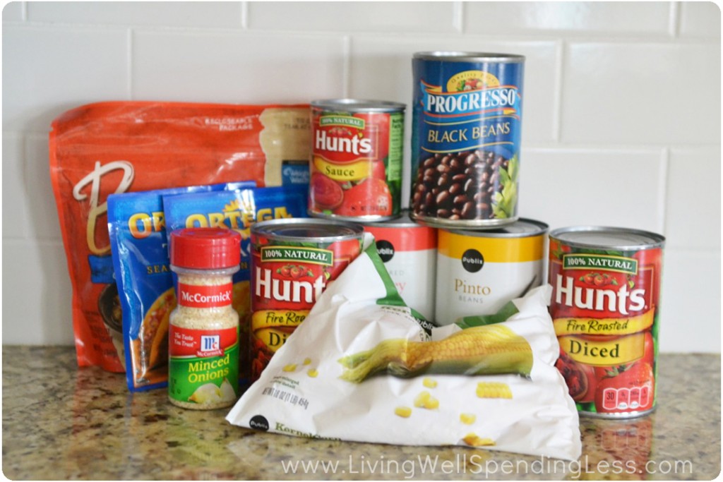 All the ingredients you need for taco soup: Beans, taco seasoning, tomatoes, corn, crumbles and onions. 