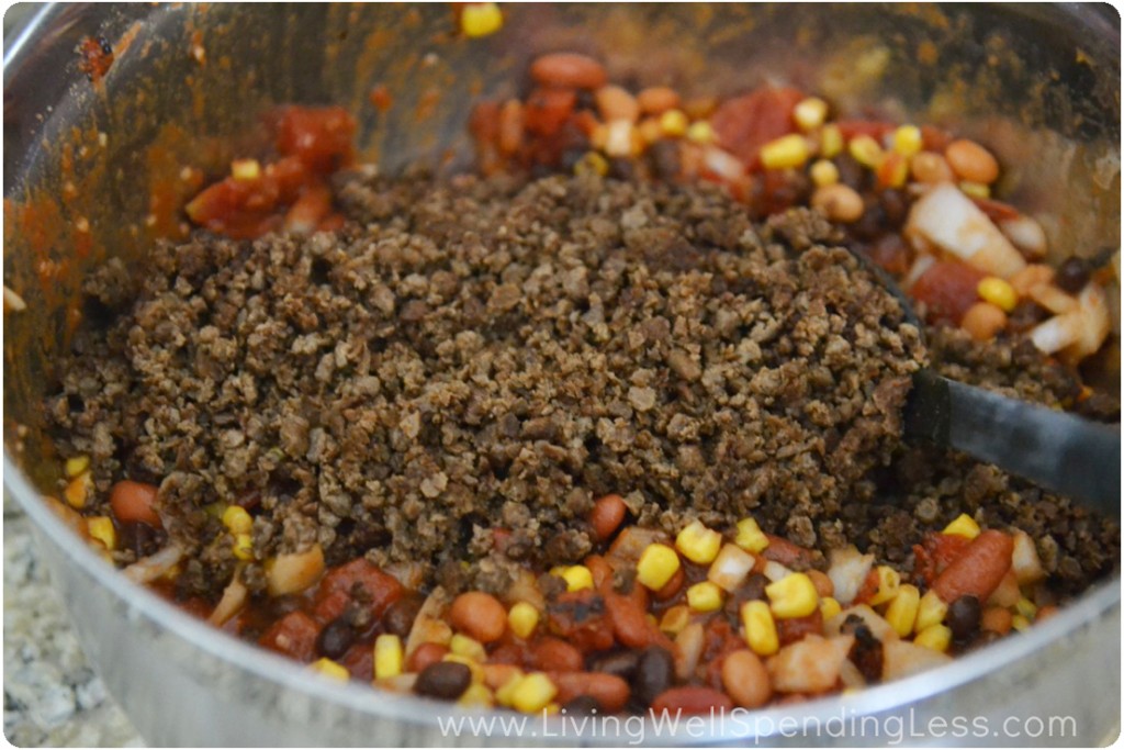 Fold the soy crumbles into your soup mixture of beans, corn and tomatos. 
