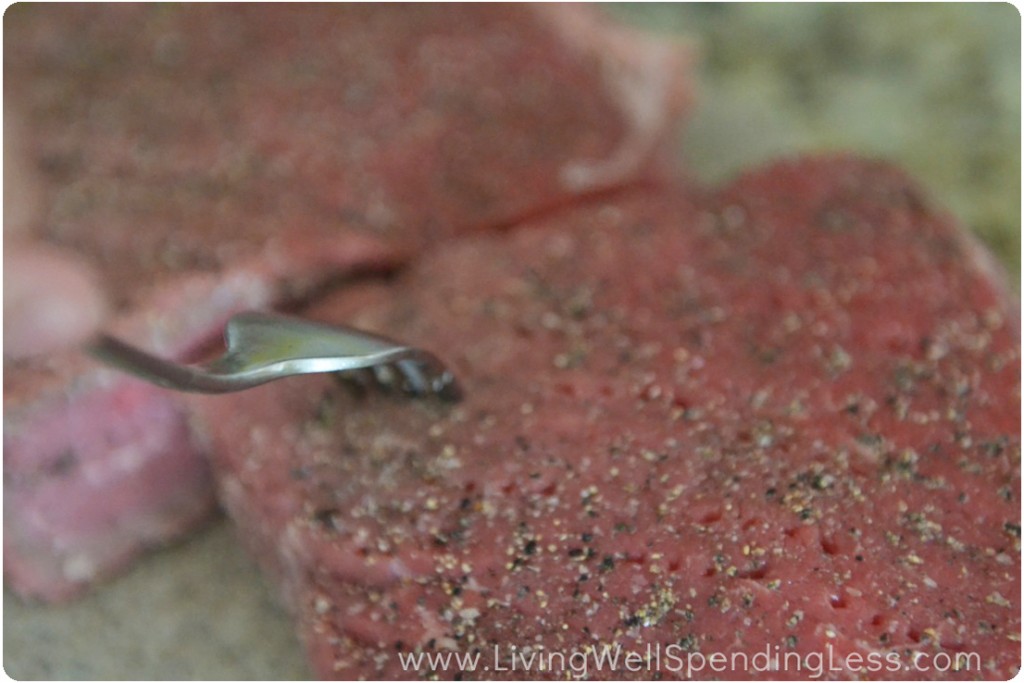 Using a fork to poke holes in the meat, helps it tenderize as it cooks. 