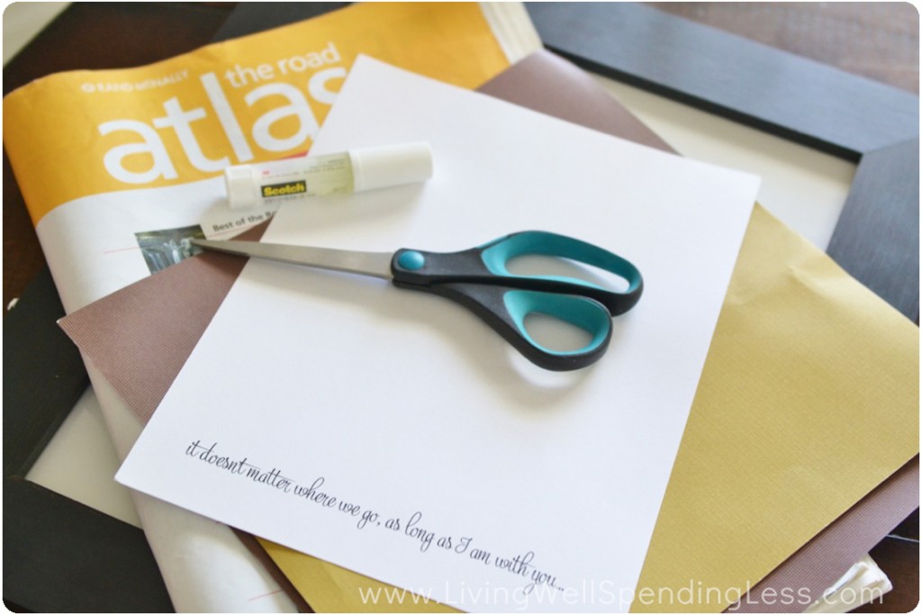 Gather the supplies: an old atlas, scissors, paper and glue. 