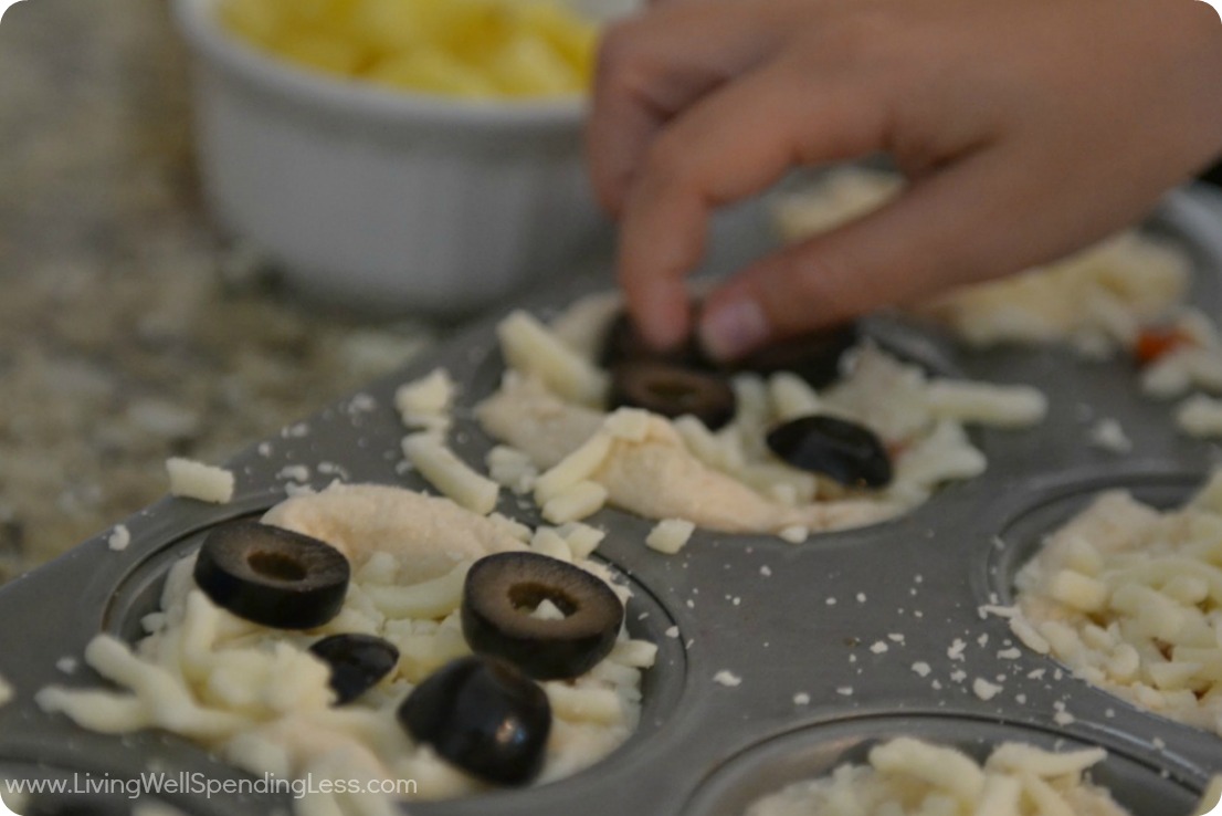 Add olives to mini pizzas 