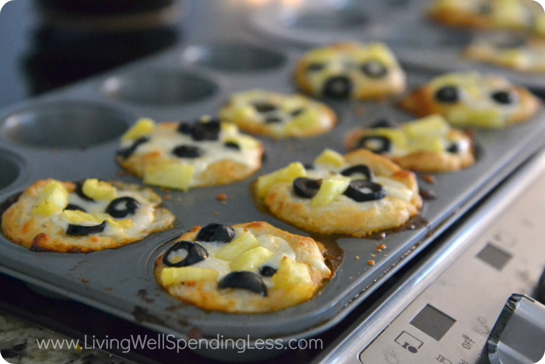 Bake pizza biscuits until bubbly and golden brown 