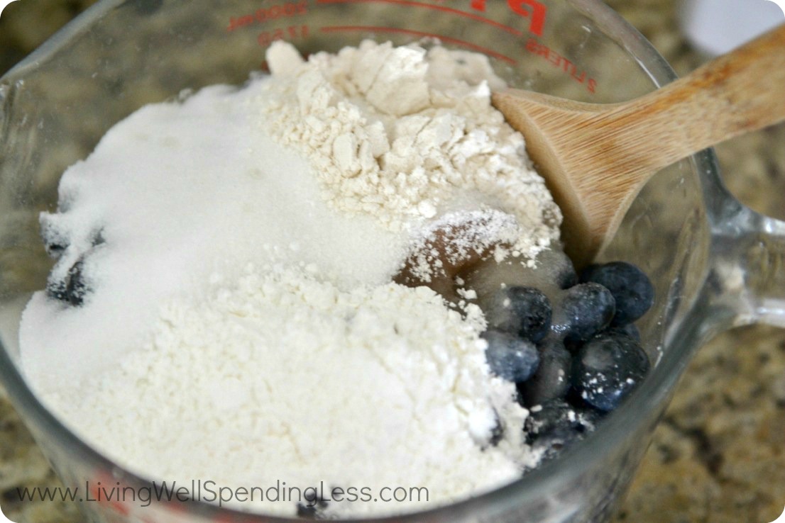 In a large bowl or measuring cup, mix the blueberries, starch and sugar using a wooden spoon or spatula. 