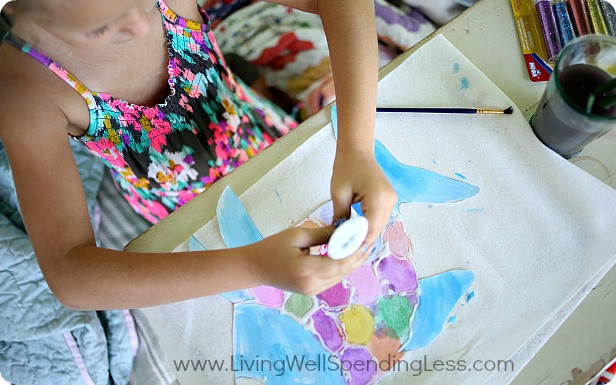 After your fish is painted and dried, outline a scale pattern using the glue.