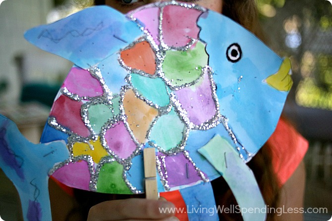 Add a clothes pin to your colorful rainbow fish to make a puppet out of him.