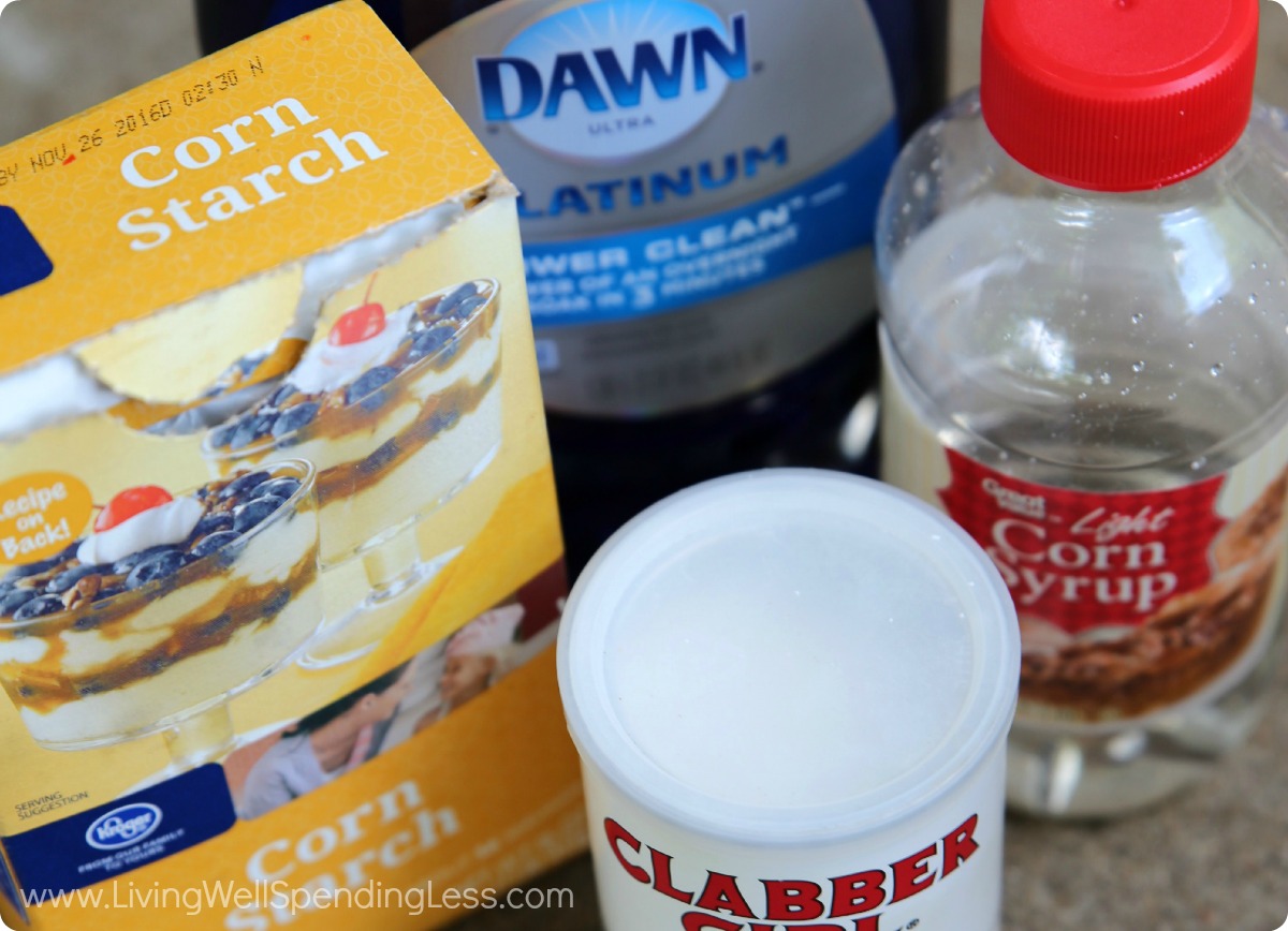 Assemble your materials for the homemade bubbles: corn starch, baking powder, corn syrup and dish soap. 