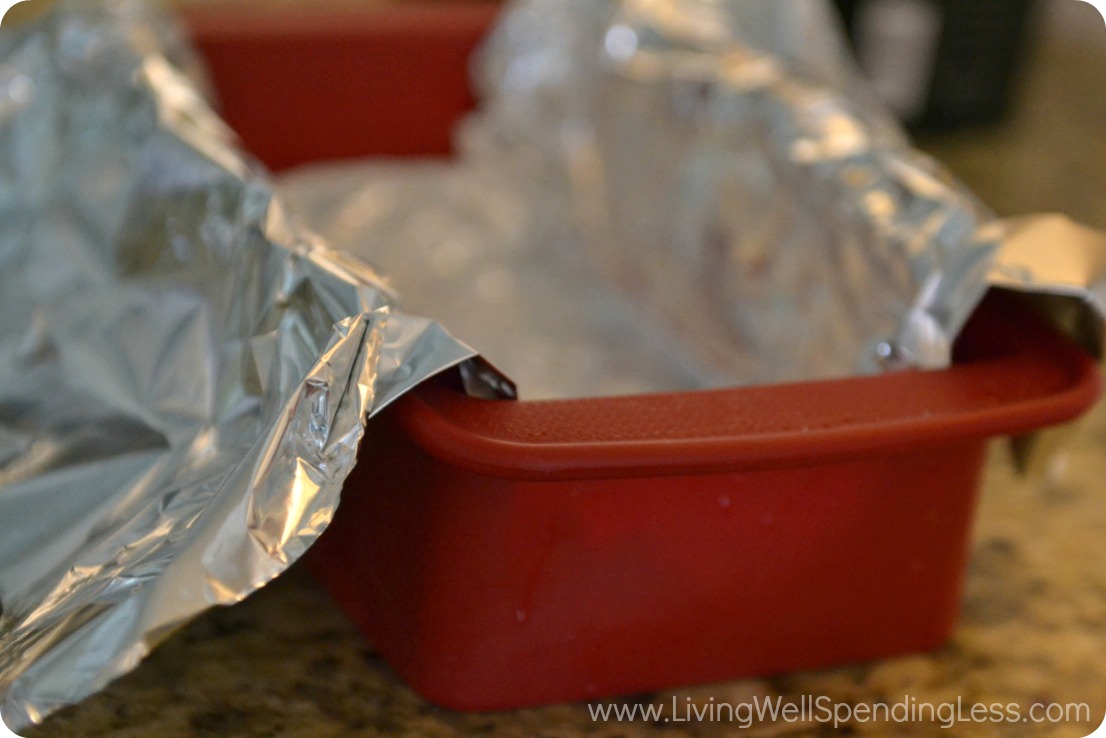 Line a pan with heavy foil to begin making your ice cream cake. 
