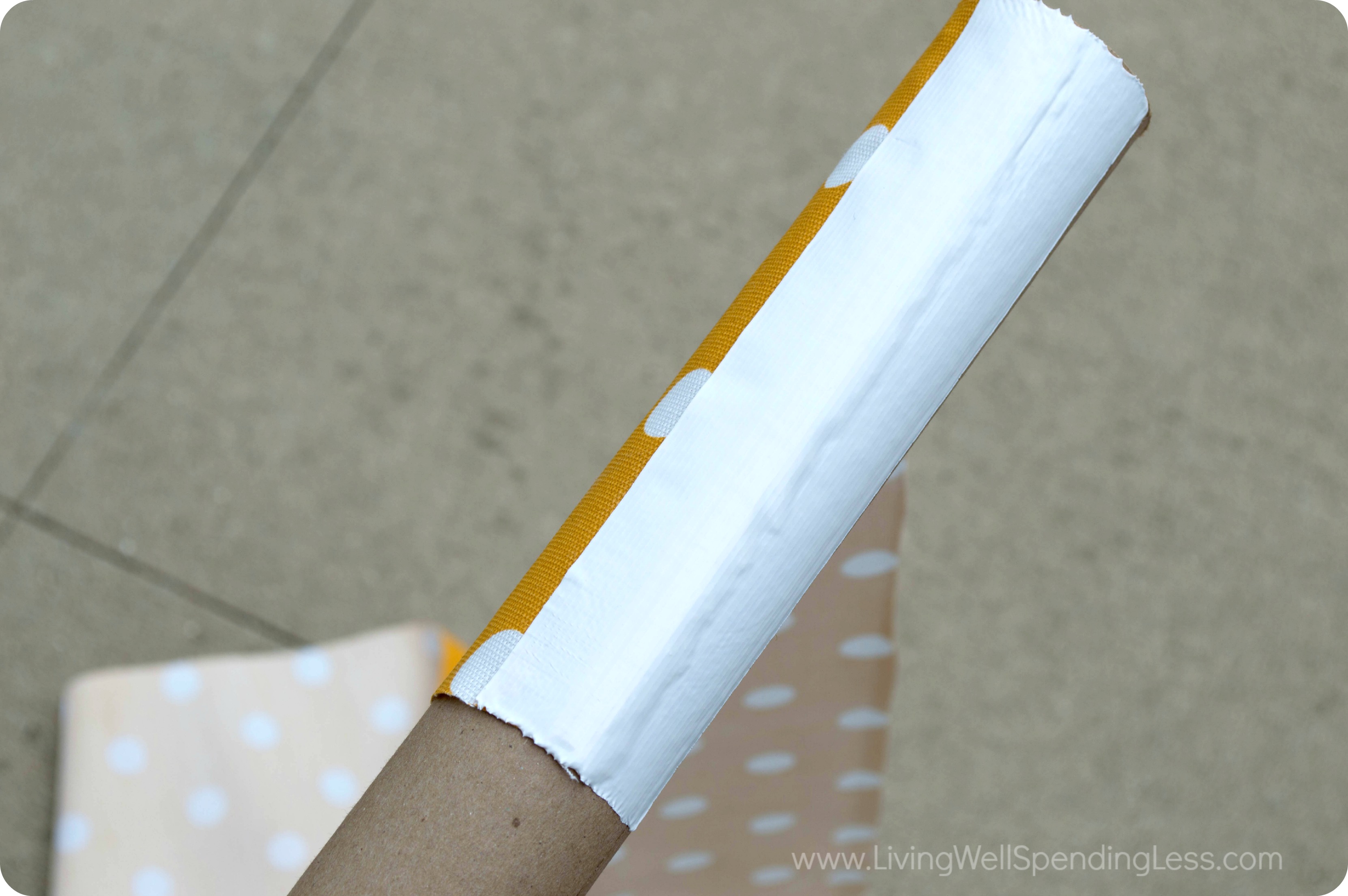 Attach fabric to cardboard tubes for the counter top legs