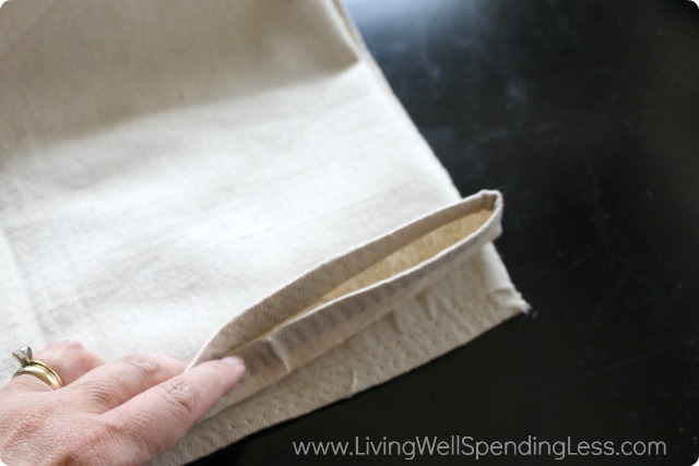 Fold the canvas drop cloth into thirds to measure out the game board squares. 